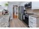 Modern kitchen with stainless steel appliances and granite countertops at 1514 Wensley Dr, Charlotte, NC 28210