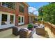 Relaxing backyard deck with outdoor seating, and a brick facade at 16216 Woolwine Rd, Charlotte, NC 28278