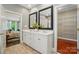 A well-appointed bathroom with double sinks, and access to a walk-in closet and a bedroom at 16216 Woolwine Rd, Charlotte, NC 28278