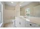 Bright bathroom featuring a vanity with granite counters, a mirror, and a shower-tub combo at 16216 Woolwine Rd, Charlotte, NC 28278