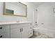 Bright bathroom with tiled floors and a modern vanity and mirror at 16216 Woolwine Rd, Charlotte, NC 28278