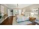 Well-lit bedroom with hardwood floors, stylish decor, and doorways to other rooms at 16216 Woolwine Rd, Charlotte, NC 28278