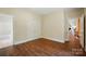 Spacious bedroom featuring hardwood floors and views of other rooms in the house at 16216 Woolwine Rd, Charlotte, NC 28278