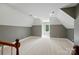 Spacious bonus room with neutral carpet, gray and white paint scheme, and a window with natural light at 16216 Woolwine Rd, Charlotte, NC 28278