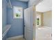 Walk-in closet with shelving and open door, ideal for organization and storage at 16216 Woolwine Rd, Charlotte, NC 28278