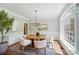 Charming dining room with a round table, large windows, and natural light at 16216 Woolwine Rd, Charlotte, NC 28278