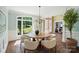 Bright dining area boasts a round table, ample windows, and a serene outdoor view at 16216 Woolwine Rd, Charlotte, NC 28278