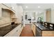 Modern kitchen featuring granite countertops, white cabinetry, and stainless steel appliances at 16216 Woolwine Rd, Charlotte, NC 28278
