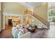 Sun-filled open floor plan with kitchen access, an upper-level balcony, and access to the front entrance at 16216 Woolwine Rd, Charlotte, NC 28278