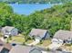 Aerial view of a lakefront property showing a beautiful lake and surrounding houses at 16427 Cozy Cove Rd, Charlotte, NC 28278