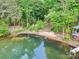 Scenic view of the lake with a private sandy beach and easy access to the water at 16427 Cozy Cove Rd, Charlotte, NC 28278
