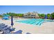 Resort-style swimming pool with lap lanes, a slide, comfortable lounge chairs, and a clubhouse at 16427 Cozy Cove Rd, Charlotte, NC 28278