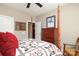 Bedroom showcasing a four-poster bed, a wooden dresser, and neutral wall paint at 2114 N Castle Ct, Matthews, NC 28105