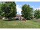 Community gazebo with seating among lush trees and well-manicured lawn at 2114 N Castle Ct, Matthews, NC 28105