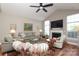 Spacious living room with hardwood floors, fireplace, vaulted ceiling, and neutral decor at 2114 N Castle Ct, Matthews, NC 28105