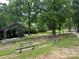 Outdoor amphitheater with tiered seating surrounded by lush trees and greenery at 2115 Mecklenburg Ave, Charlotte, NC 28205