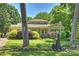 Charming home featuring a well-manicured lawn and vibrant flower beds at 2115 Mecklenburg Ave, Charlotte, NC 28205