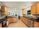 Modern kitchen with stainless steel appliances, granite countertops, and a view into the living room at 2115 Mecklenburg Ave, Charlotte, NC 28205