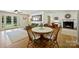 Open-concept living room with hardwood floors and ample natural light from French doors at 2115 Mecklenburg Ave, Charlotte, NC 28205