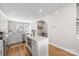 Modern kitchen with stainless appliances, island with seating, and access to backyard at 2123 Bryant Park Dr, Charlotte, NC 28208
