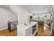 Open kitchen with modern appliances, center island, and seamless flow to the living area at 2123 Bryant Park Dr, Charlotte, NC 28208