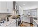 Modern kitchen features stainless steel appliances, quartz countertops, and stylish hardware at 2123 Bryant Park Dr, Charlotte, NC 28208