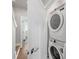 Convenient laundry room features a stacked washer and dryer for efficient space utilization at 2123 Bryant Park Dr, Charlotte, NC 28208