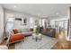 Bright open-concept living room showcasing a cozy sectional sofa and an elegant area rug at 2123 Bryant Park Dr, Charlotte, NC 28208