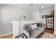 Loft area featuring a comfortable gray couch and stylish decor at 2123 Bryant Park Dr, Charlotte, NC 28208