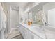 Elegant bathroom with a double vanity, sleek countertops, a glass-enclosed shower, and modern fixtures for a spa-like experience at 2123 Bryant Park Dr, Charlotte, NC 28208