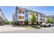 Street view of modern townhomes with gray and white siding, and well-maintained landscaping and street signage at 2123 Bryant Park Dr, Charlotte, NC 28208