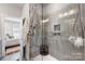 Modern walk-in shower with tiled walls, glass door, and contemporary fixtures, offering a luxurious and convenient bathing space at 2123 Bryant Park Dr, Charlotte, NC 28208