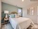 Charming bedroom with a rattan headboard, side tables, decorative lamps, and natural light from the window at 2159 Trollinger Dr, Catawba, NC 28609