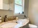 Granite countertop and brushed nickel faucet accent this bathroom at 217 Hickory Dr, Mooresville, NC 28115