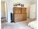 Bedroom featuring a large dresser and access to the bathroom at 217 Hickory Dr, Mooresville, NC 28115