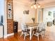 Inviting dining room boasts stylish lighting and a rustic-chic decor, perfect for Gathering meals at 217 Hickory Dr, Mooresville, NC 28115