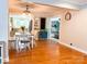 Charming dining area connects to an open floor plan, featuring hardwood floors and stylish lighting at 217 Hickory Dr, Mooresville, NC 28115