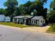 Charming home with a well-manicured front lawn, cozy entrance, and classic architectural design at 217 Hickory Dr, Mooresville, NC 28115