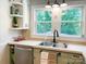 Kitchen with large window, stainless steel sink and fixtures, and stylish cabinetry at 217 Hickory Dr, Mooresville, NC 28115
