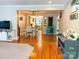 Open-concept living area seamlessly connects to the dining room, showcasing hardwood floors and lots of light at 217 Hickory Dr, Mooresville, NC 28115