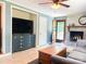 Bright living room with tile floors and a fireplace creates a welcoming atmosphere at 217 Hickory Dr, Mooresville, NC 28115