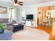 Bright living room flows into the dining area, complemented by hardwood floors and neutral decor at 217 Hickory Dr, Mooresville, NC 28115