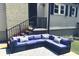 Comfortable outdoor patio with a large sectional sofa and decorative pillows, perfect for relaxation at 217 Hickory Dr, Mooresville, NC 28115