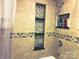 Tiled shower featuring tiled nooks for organization at 217 Hickory Dr, Mooresville, NC 28115