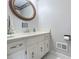Charming half bathroom with classic vanity and decorative mirror at 2235 Ramblewood Ln, Charlotte, NC 28210