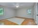 Bright bedroom with hardwood floors, two windows, and closet at 2235 Ramblewood Ln, Charlotte, NC 28210