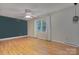 Bright bedroom showcasing hardwood floors, a ceiling fan, and a window that allows for plenty of natural light at 2235 Ramblewood Ln, Charlotte, NC 28210
