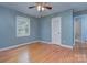 Comfortable bedroom with hardwood flooring, window, and closet at 2235 Ramblewood Ln, Charlotte, NC 28210