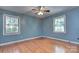 Inviting bedroom featuring hardwood floors and plenty of natural light at 2235 Ramblewood Ln, Charlotte, NC 28210