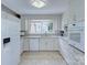 Modern kitchen with white cabinetry, granite countertops, and stainless steel appliances at 2235 Ramblewood Ln, Charlotte, NC 28210